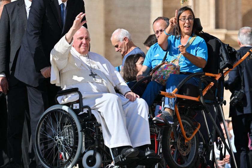 Pope Francis waves from his wheelchair as he goes to bless disabled people at the end of the weekly general audience on October 19, 2022 at St. Peter's square in The Vatican. Alberto PIZZOLI / AFP Pope Francis waves from his wheelchair as he goes to bless disabled people at the end of the weekly general audience on October 19, 2022 at St. Peter's square in The Vatican. Alberto PIZZOLI / AFP