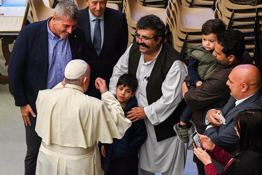 Pope Francis (Front L) meets with members of an Afghan family during the weekly general audience on October 13, 2021 at Paul-VI hall in The Vatican.  Tiziana FABI / AFP