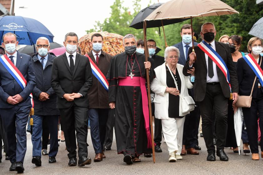 French Interior Minister Gerald Darmanin (3L), Monsignor Dominique Lebrun, Archbishop of Rouen (C), Roseline Hamel, sister of Father Jacques Hamel (3R), Mayor of Saint-Etienne-du-Rouvray Joachim Moyse (2R) attend a silent walk to the Church of Saint-Etienne in Saint-Etienne-du-Rouvray, near Rouen, northwestern France, on July 26, 2021, during a tribute to mark the 5th anniversary of the assassination of Father Jacques Hamel. French Interior Minister Gerald Darmanin (3L), Monsignor Dominique Lebrun, Archbishop of Rouen (C), Roseline Hamel, sister of Father Jacques Hamel (3R), Mayor of Saint-Etienne-du-Rouvray Joachim Moyse (2R) attend a silent walk to the Church of Saint-Etienne in Saint-Etienne-du-Rouvray, near Rouen, northwestern France, on July 26, 2021, during a tribute to mark the 5th anniversary of the assassination of Father Jacques Hamel.