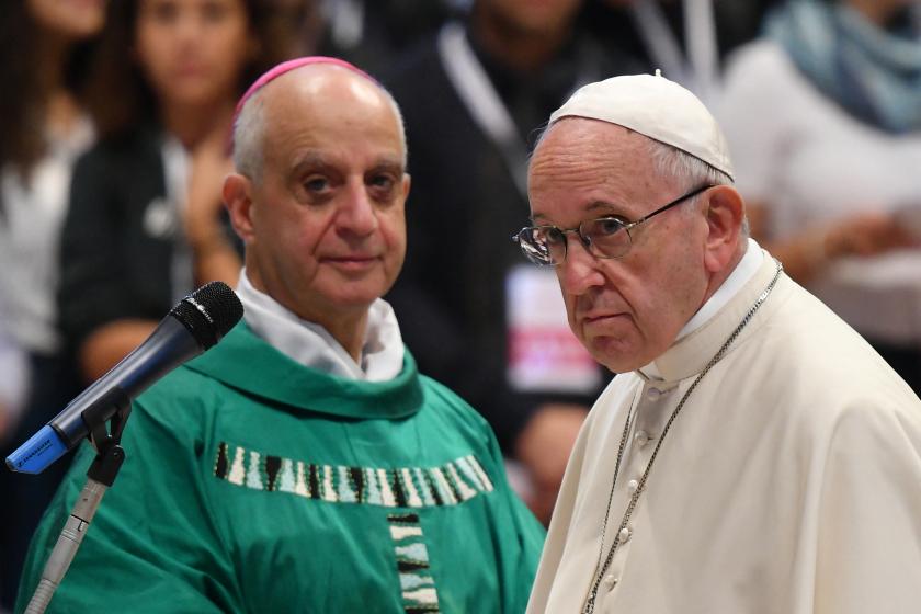 Pope Francis (R) stands by Italian Archbishop Rino Fisichella as he prepares to address youth during a mass at St. Peter's basilica in the Vatican on October 25, 2018, on the occasion of a pilgrimage at St Peter's tomb. Alberto PIZZOLI / AFP Pope Francis (R) stands by Italian Archbishop Rino Fisichella as he prepares to address youth during a mass at St. Peter's basilica in the Vatican on October 25, 2018, on the occasion of a pilgrimage at St Peter's tomb.