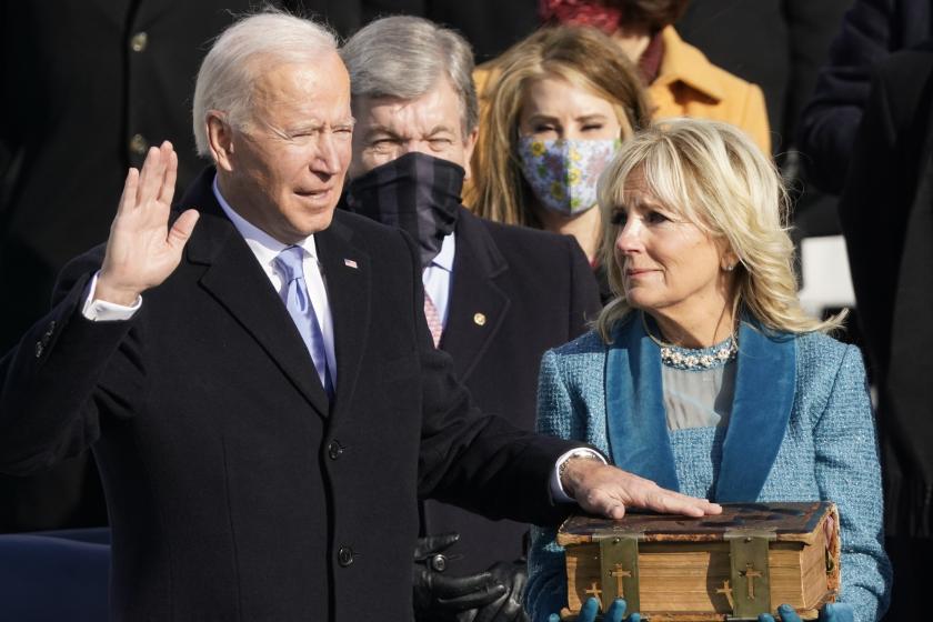 Joe Biden (L), flanked by incoming US First Lady Jill Biden is sworn in as the 46th US President by Supreme Court Chief Justice John Roberts on January 20, 2021, at the US Capitol in Washington, DC. Andrew Harnik / POOL / AFP Joe Biden (L), flanked by incoming US First Lady Jill Biden is sworn in as the 46th US President by Supreme Court Chief Justice John Roberts on January 20, 2021, at the US Capitol in Washington, DC. Andrew Harnik / POOL / AFP