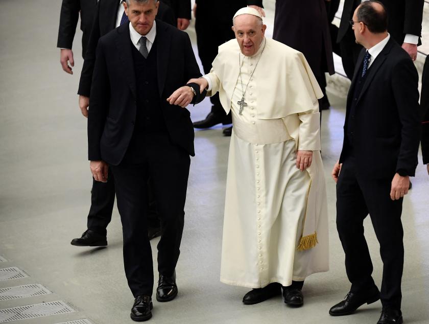Pope Francis, escorted by his butler Sandro Mariotti, (L) is helped walk during the weekly general general audience at Paul-VI Hall in the Vatican on January 26, 2021. Filippo MONTEFORTE / AFP Pope Francis, escorted by his butler Sandro Mariotti, (L) is helped walk during the weekly general general audience at Paul-VI Hall in the Vatican on January 26, 2021.