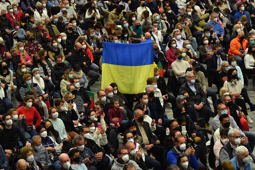 An attendee holds the national flag of Ukraine during the Pope's weekly general audience on March 16, 2022 at Paul-VI hall in The Vatican. Tiziana FABI / AFP An attendee holds the national flag of Ukraine during the Pope's weekly general audience on March 16, 2022 at Paul-VI hall in The Vatican.