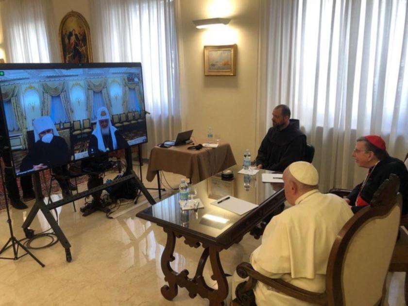 This photo taken and handout on March 16, 2022 by The Vatican Media shows Pope Francis (Front R) talking with Russia's Orthodox Patriarch Kirill (2ndL rear on television screen) during a virtual audience via videolink in The Vatican. The Church "must not use the language of politics, but the language of Jesus", Pope Francis told Russian Orthodox Patriarch Kirill during talks on March 16 about Ukraine, the Vatican said. The head of the Catholic church held a video call with Kirill, a key pillar of President Vladimir Putin's ruling apparatus, where he said both men should be "united in the effort to help peace" following Russia's invasion on February 24. This photo taken and handout on March 16, 2022 by The Vatican Media shows Pope Francis (Front R) talking with Russia's Orthodox Patriarch Kirill (2ndL rear on television screen) during a virtual audience via videolink in The Vatican. The Church "must not use the language of politics, but the language of Jesus", Pope Francis told Russian Orthodox Patriarch Kirill during talks on March 16 about Ukraine, the Vatican said. The head of the Catholic church held a video call with Kirill, a key pillar of President