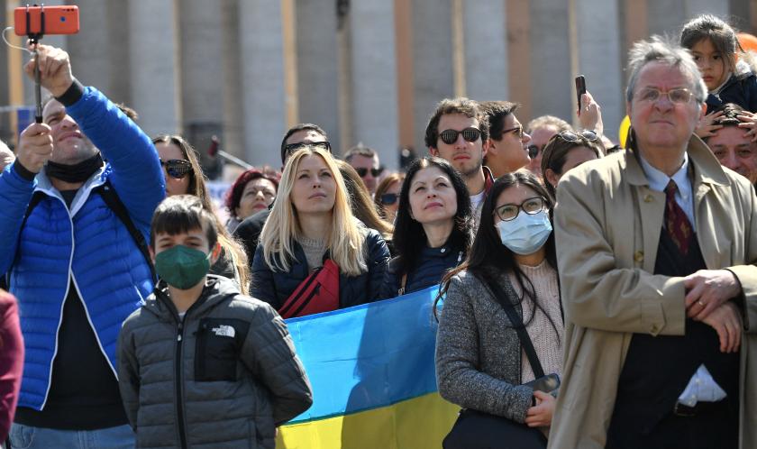 Women hold the national flag of Ukraine during the Pope's weekly Angelus prayer on March 20, 2022 at St. Peter's square in The Vatican. Tiziana FABI / AFP Women hold the national flag of Ukraine during the Pope's weekly Angelus prayer on March 20, 2022 at St. Peter's square in The Vatican.