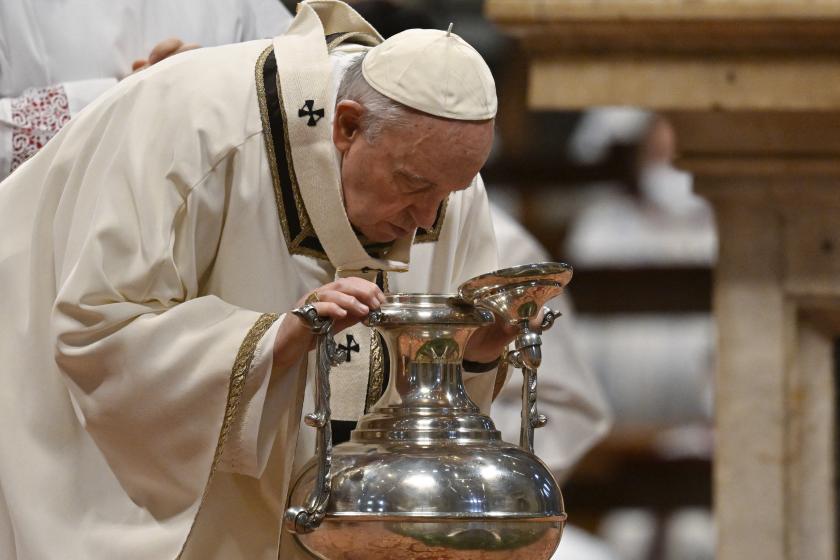 Pope Francis blows into a silver jar containing the Holy Chrism during its blessing as part of Holy Chrism mass on April 14, 2022 at St. Peter's Basilica in The Vatican. Alberto PIZZOLI / AFP Pope Francis blows into a silver jar containing the Holy Chrism during its blessing as part of Holy Chrism mass on April 14, 2022 at St. Peter's Basilica in The Vatican.