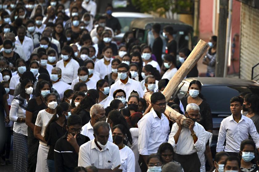 Christian devotees take part in the annual Way of the Cross procession, which symbolises the final journey of Jesus Christ before he was crucified, on Good Friday in Colombo on April 15, 2022. ISHARA S. KODIKARA / AFP Christian devotees take part in the annual Way of the Cross procession, which symbolises the final journey of Jesus Christ before he was crucified, on Good Friday in Colombo on April 15, 2022.