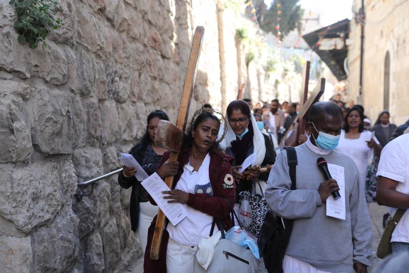 Franciscan friars join believers in prayer at the Church of the Holy Sepulchre, during the Good Friday procession in Jerusalem's Old City, on April 15, 2022. HAZEM BADER / AFP Franciscan friars join believers in prayer at the Church of the Holy Sepulchre, during the Good Friday procession in Jerusalem's Old City, on April 15, 2022.