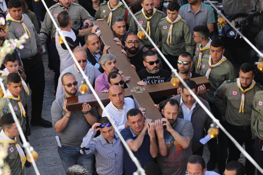 Christians hold crosses during the Good Friday procession along the Via Dolorosa, the Old city of Jerusalem, 15 April 2022. Israeli police is on super high alert as the Christians celebrate Holy Week, Muslims celebrate Ramadan and Jews celebrate Passover fall at the same time. EPA/ABIR SULTAN Christians hold crosses during the Good Friday procession along the Via Dolorosa, the Old city of Jerusalem, 15 April 2022. Israeli police is on super high alert as the Christians celebrate Holy Week, Muslims celebrate Ramadan and Jews celebrate Passover fall at the same time.