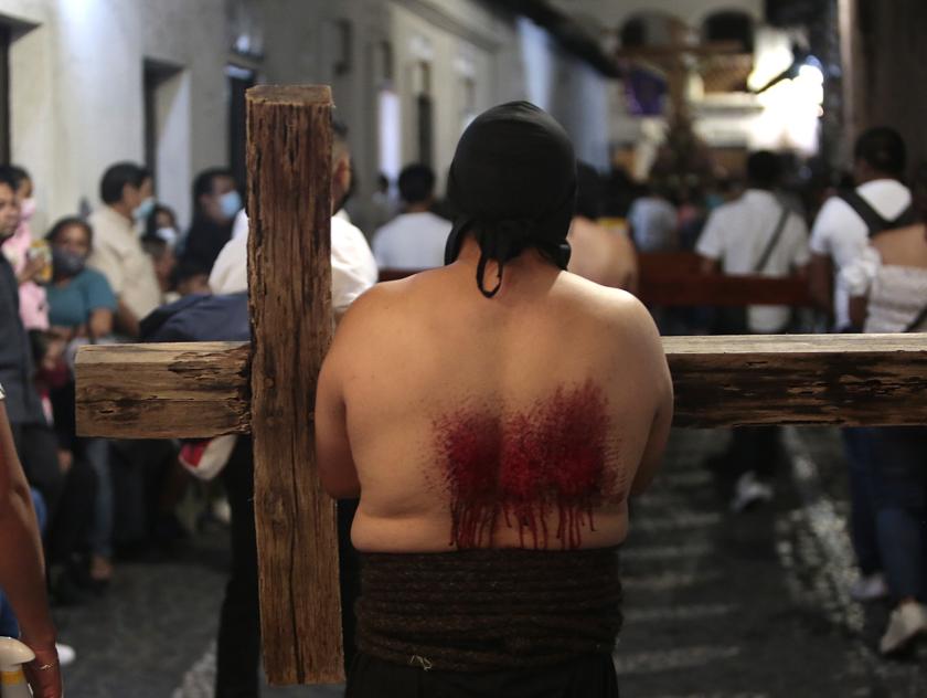 Hooded people carry crosses as they re-enact the Passion of the Christ during a procession on Good Friday during the Holy Week in the municipality of Taxco, in the state of Guerrero, Mexico, 15 April 2022. EPA/JOSE LUIS DE LA CRUZ Hooded people carry crosses as they re-enact the Passion of the Christ during a procession on Good Friday during the Holy Week in the municipality of Taxco, in the state of Guerrero, Mexico, 15 April 2022.