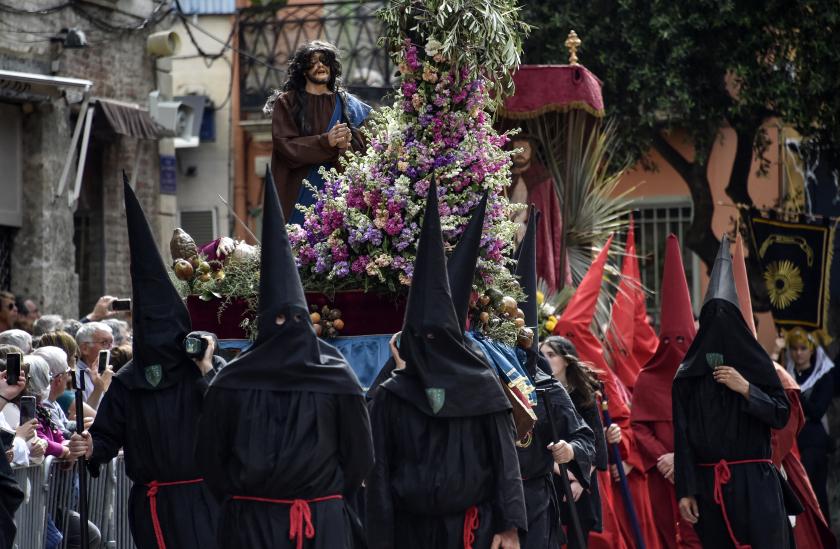 Catholic devotees wearing capirotes take part in the traditional Sanch Procession on Good Friday in Perpignan, southern France, on April 15, 2022. AFP Catholic devotees wearing capirotes take part in the traditional Sanch Procession on Good Friday in Perpignan, southern France, on April 15, 2022.