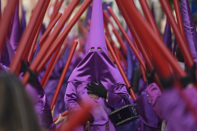Penitents of the 'Hermandad de El Cachorro' (lit. 'Brotherhood of The Cub') take part in a religious procession along Triana's bridge to mark Good Friday in Seville, Spain, 15 April 2022. Spanish Holy Week runs from 10 to 17 April 2022. EPA/Raul Caro Penitents of the 'Hermandad de El Cachorro' (lit. 'Brotherhood of The Cub') take part in a religious procession along Triana's bridge to mark Good Friday in Seville, Spain, 15 April 2022. Spanish Holy Week runs from 10 to 17 April 2022.
