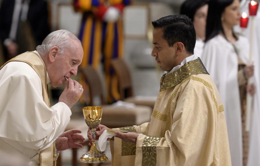 Pope Francis receives the Communion during the Easter Vigil Mass in Saint Peter's Basilica at the Vatican, 16 April 2022. EPA/CLAUDIO PERI Pope Francis receives the Communion during the Easter Vigil Mass in Saint Peter's Basilica at the Vatican, 16 April 2022.