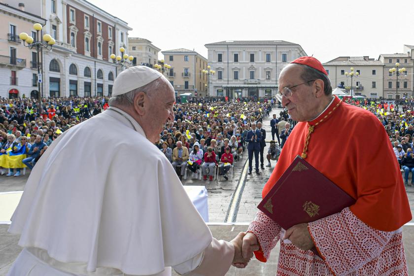This photo taken and handout on August 28, 2022 by The Vatican Media shows Archbishop of l'Aquila, Italian Cardinal Giuseppe Petrocchi (R) greeting Pope Francis as he arrives on stage outside the Duomo cathedral in L'Aquila, on August 28, 2022 during a one-day pastoral visit to the 2009 earthquake-struck Abruzzo capital. Handout / VATICAN MEDIA This photo taken and handout on August 28, 2022 by The Vatican Media shows Archbishop of l'Aquila, Italian Cardinal Giuseppe Petrocchi (R) greeting Pope Francis as he arrives on stage outside the Duomo cathedral in L'Aquila, on August 28, 2022 during a one-day pastoral visit to the 2009 earthquake-struck Abruzzo capital. Handout / VATICAN MEDIA
