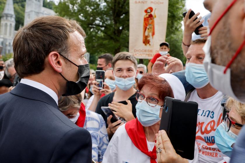 French President Emmanuel Macron arrives for a visit at the Catholic sanctuary of Notre Dame de Lourdes, southwestern France, on July 16, 2021. Macron is on a two-day visit in southwestern France, notably to attend stages of the 108th edition of the Tour de France cycling race. Ludovic MARIN / AFP French President Emmanuel Macron arrives for a visit at the Catholic sanctuary of Notre Dame de Lourdes, southwestern France, on July 16, 2021. Macron is on a two-day visit in southwestern France, notably to attend stages of the 108th edition of the Tour de France cycling race.
