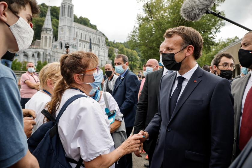 French President Emmanuel Macron arrives for a visit at the Catholic sanctuary of Notre Dame de Lourdes, southwestern France, on July 16, 2021. Macron is on a two-day visit in southwestern France, notably to attend stages of the 108th edition of the Tour de France cycling race. Ludovic MARIN / AFP French President Emmanuel Macron arrives for a visit at the Catholic sanctuary of Notre Dame de Lourdes, southwestern France, on July 16, 2021. Macron is on a two-day visit in southwestern France, notably to attend stages of the 108th edition of the Tour de France cycling race.
