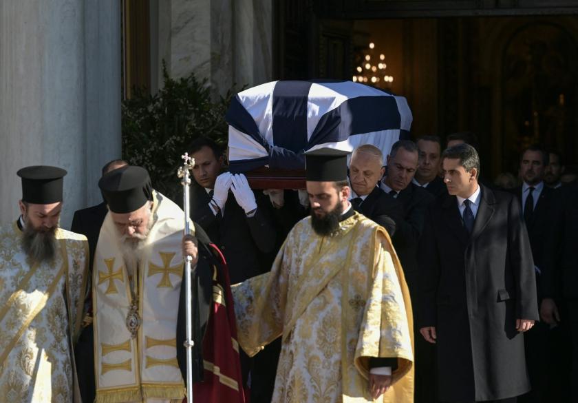 Members of the Greek Orthodox clergy leave after the funeral service and carriers move the coffin of former King of Greece Constantine II out of the Metropolitan Cathedral of Athens, on January 16, 2023. Dozens of European royals and hundreds of Greeks gathered in Athens for the funeral of Greece's last king, Constantine II, who died aged 82.
Aris Messinis / AFP Members of the Greek Orthodox clergy leave after the funeral service and carriers move the coffin of former King of Greece Constantine II out of the Metropolitan Cathedral of Athens, on January 16, 2023. Dozens of European royals and hundreds of Greeks gathered in Athens for the funeral of Greece's last king, Constantine II, who died aged 82.
Aris Messinis / AFP