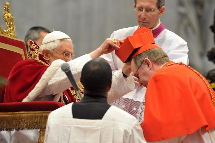 Pope Benedict XVI (left) places the scarlet-red biretta on the head of new Cardinal Wim Eijk of The Netherlands during a ceremony in St. Peter's Basilica, Vatican City 18 February 2012 when the pontiff created 22 new cardinals, 18 of which are eligible to vote for the next pope. EPA/OSSERVATORE ROMANO EDITORIAL Pope Benedict XVI (left) places the scarlet-red biretta on the head of new Cardinal Wim Eijk of The Netherlands during a ceremony in St. Peter's Basilica, Vatican City 18 February 2012 when the pontiff created 22 new cardinals, 18 of which are eligible to vote for the next pope. EPA/OSSERVATORE ROMANO EDITORIAL