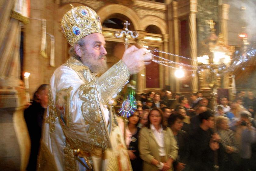 Greek Orthodox Patriarch in the Holy Land Irenios I swings incense during Easter Sunday mass at the Holy Church of the Sepulchre in the Old City of Jerusalem 05 May 2002. Orthodox Christians around the world are celebrating easter, commemorating the Resurrection of Jesus. AFP PHOTO/Gali TIBBON Greek Orthodox Patriarch in the Holy Land Irenios I swings incense during Easter Sunday mass at the Holy Church of the Sepulchre in the Old City of Jerusalem 05 May 2002. Orthodox Christians around the world are celebrating easter, commemorating the Resurrection of Jesus. AFP PHOTO/Gali TIBBON