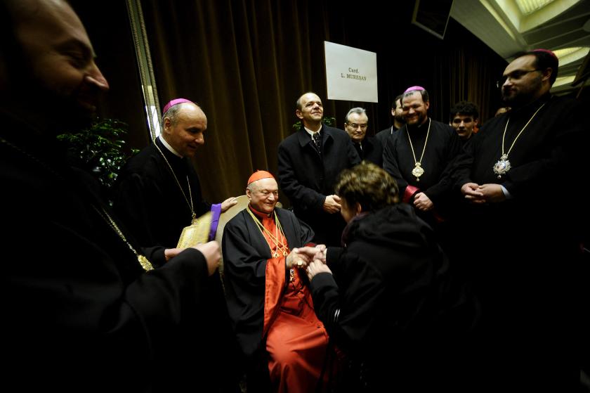 Cardinal Lucian Muresan (C) greets visitors during the traditionnal courtesy visit after the consistory at the Vatican on February 18, 2012. Pope Benedict XVI on Saturday put his stamp of authority on the body that will elect his successor as he appointed 22 new cardinals at a time of roiling tensions in the Vatican administration. AFP PHOTO / FILIPPO MONTEFORTE