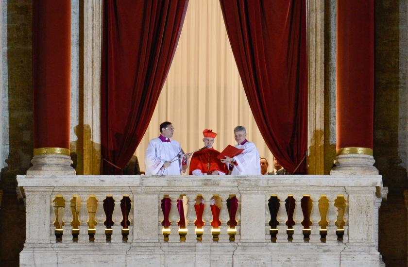 French proto-deacon cardinal Jean-Louis Tauran (C) arrives to announce the name of the elected cardinal and the papal title he has chosen on March 13, 2013 from the balcony of St Peter's basilica at the Vatican. Argentina's Jorge Mario Bergoglio was elected Pope Francis I on Wednesday, becoming the church's first Latin American pontiff after a conclave to elect a leader of the world's 1.2 billion Catholics. AFP PHOTO / ANDREAS SOLARO Andreas SOLARO / AFP