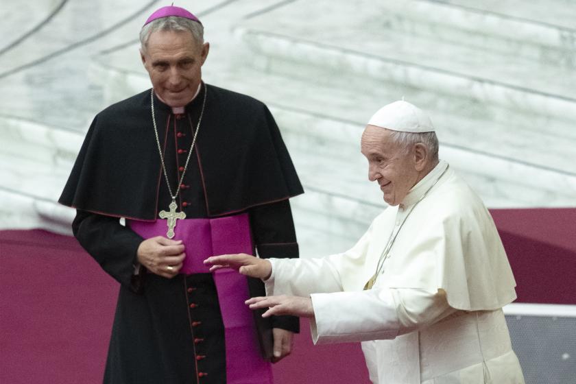 Pope Francis (R), flanked by Prefect of the Papal Household, German Archbishop Georg Gaenswein, gestures towards attendees during an audience with Parish Cells of Evangelization on November 18, 2019 at Paul-VI hall in the Vatican. Tiziana FABI / AFP