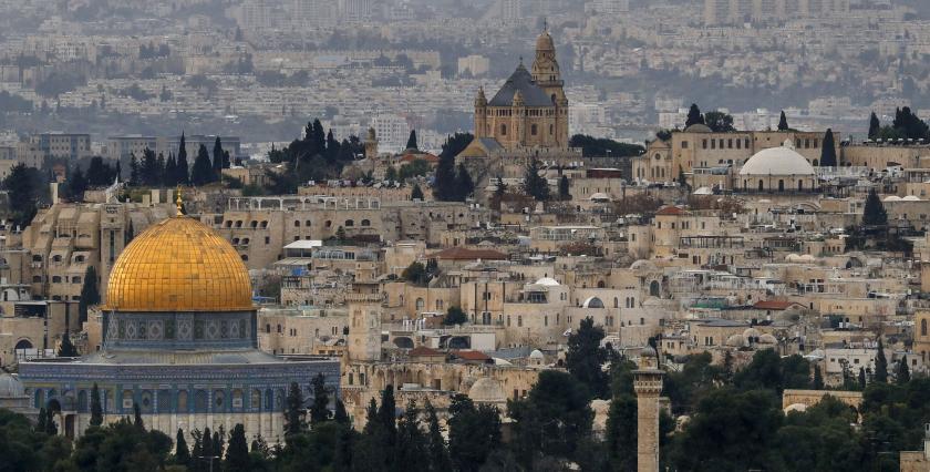 The Dome of the Rock (L), in the Al-Aqsa mosques compound and the Abbey of the Dormition (C) on Mount Zion, a Benedictine Basilica, built over the site where Virgin Mary is said to have fallen asleep for the last time, in Jerusalem's Old City. AHMAD GHARABLI / AFP