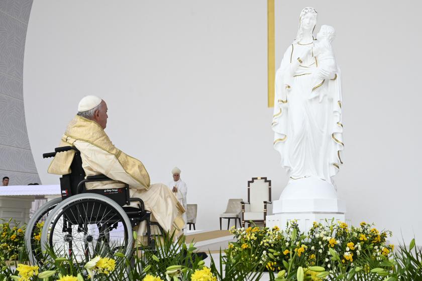 This handout photo released by the Vatican Media shows Pope Francis presiding over an open-air mass at Bahrain National Stadium in Riffa, near the capital Manama, on November 5, 2022. About 30,000 flag-waving worshippers joined an open-air mass held by Pope Francis in mainly Muslim Bahrain, the highlight of his outreach mission to the Gulf. VATICAN MEDIA 