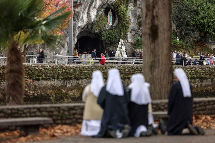 Nuns pray near the Massabielle cave (R) in the Sanctuary of Lourdes, south-western France on November 7, 2022. Charly TRIBALLEAU / AFP Nuns pray near the Massabielle cave (R) in the Sanctuary of Lourdes, south-western France on November 7, 2022. Charly TRIBALLEAU / AFP