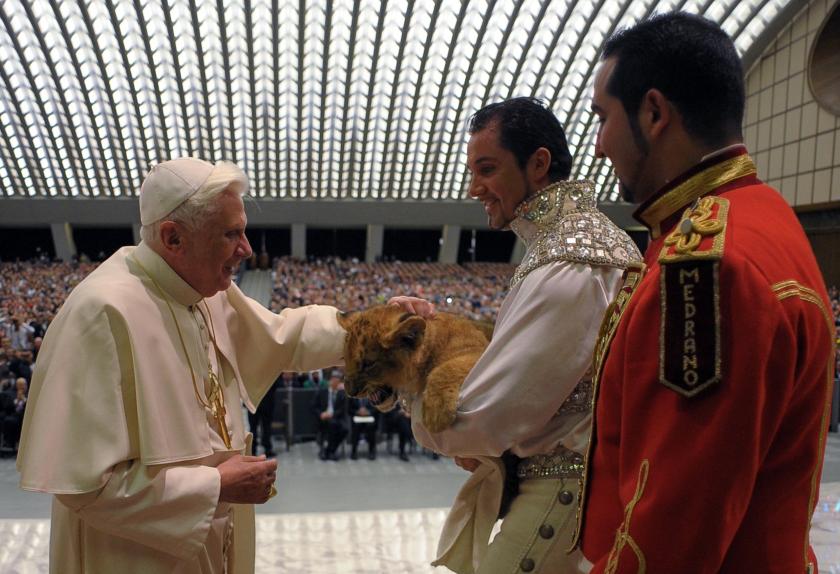 This handout picture released by The Vatican Press Office on January 28, 2009 shows Pope Benedict XVI (L) stroking a baby lion held by representatives of he Medrano circus during the Papal weekly general audience at Paul VI audience hall at the Vatican. AFP PHOTO / OSSERVATORE ROMANO This handout picture released by The Vatican Press Office on January 28, 2009 shows Pope Benedict XVI (L) stroking a baby lion held by representatives of he Medrano circus during the Papal weekly general audience at Paul VI audience hall at the Vatican. AFP PHOTO / OSSERVATORE ROMANO