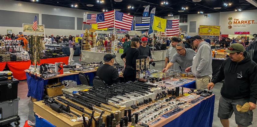 Men browse as vendors sell firearms and accessories at the Crossroads of the West Gun Show at the Convention Center in Ontario, California, on January 28, 2023. The Gun Show is located 32 miles away from the Star Ballroom Dance Studio, the site of the mass shooting that took the lives of 11 people and injured 10 others during the Lunar New Year's Eve in Monterey, California. Apu GOMES / AFP