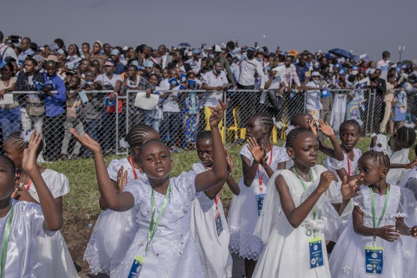 Attendees cheer while Pope Francis (not seen) arrives for the mass at the N'Dolo Airport in Kinshasa, Democratic Republic of Congo (DRC), on February 1, 2023. Guerchom Ndebo / AFP Attendees cheer while Pope Francis (not seen) arrives for the mass at the N'Dolo Airport in Kinshasa, Democratic Republic of Congo (DRC), on February 1, 2023. Guerchom Ndebo / AFP