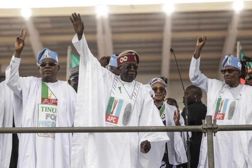 All Progressive Congress (APC) leader Bola Tinubu (C) and President of Nigeria Muhammadu Buhari (R) gesture towards the crowd during the APC party campaign rally at Teslim Balogun Stadium in Lagos on February 21, 2023 ahead of the Nigerian presidential election scheduled for February 25, 2023. Michele Spatari / AFP All Progressive Congress (APC) leader Bola Tinubu (C) and President of Nigeria Muhammadu Buhari (R) gesture towards the crowd during the APC party campaign rally at Teslim Balogun Stadium in Lagos on February 21, 2023 ahead of the Nigerian presidential election scheduled for February 25, 2023. Michele Spatari / AFP