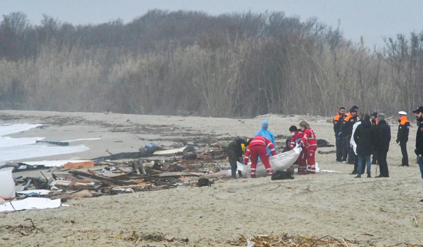 This photo obtained from Italian news agency Ansa, taken on February 26, 2023 shows bags containing the bodies of deceased migrants in Steccato di Cutro, south of Crotone, after their boat sank off Italy's southern Calabria region. More than 30 migrants, including a tiny baby, died after their overloaded boat sank early on February 26, 2023 in stormy seas off Italy's southern Calabria region, Italian media and rescue services reported.  STRINGER / ANSA / AFP