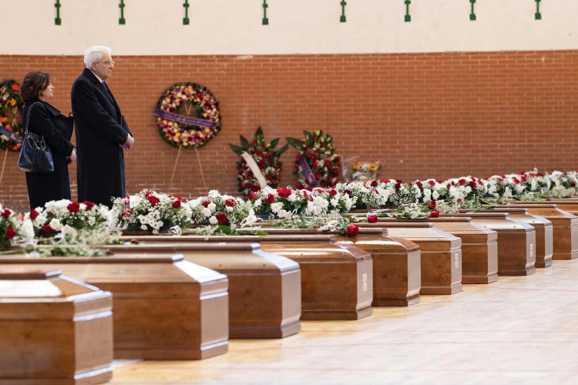 This handout photo taken on March 2, 2023, and released by the Quirinale press office, shows Italy’ President Sergio Mattarella (2ndL) standing in front of the coffins of migrants who died days before, after a boat sank off Italy's southern Calabria region, at the Crotone Palasport, which is serving as a temporary funeral home for the victims, in Steccato di Cutro, south of Crotone. This handout photo taken on March 2, 2023, and released by the Quirinale press office, shows Italy’ President Sergio Mattarella (2ndL) standing in front of the coffins of migrants who died days before, after a boat sank off Italy's southern Calabria region, at the Crotone Palasport, which is serving as a temporary funeral home for the victims, in Steccato di Cutro, south of Crotone.