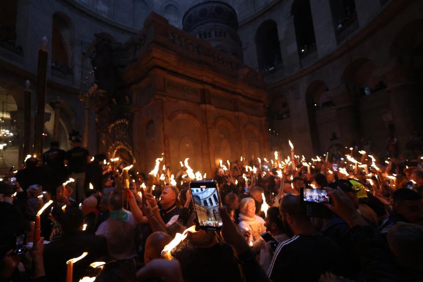 Orthodox Christians gather with lit candles during the Holy Fire ceremony at the Holy Sepulchre church in Jerusalem's Old City on April 15, 2023 on the eve of Easter Sunday. The ceremony celebrated in the same way for 11 centuries, is marked by the appearance of "sacred fire" in the two cavities on either side of the Holy Sepulchre. Menahem KAHANA / AFP Orthodox Christians gather with lit candles during the Holy Fire ceremony at the Holy Sepulchre church in Jerusalem's Old City on April 15, 2023 on the eve of Easter Sunday. The ceremony celebrated in the same way for 11 centuries, is marked by the appearance of "sacred fire" in the two cavities on either side of the Holy Sepulchre. Menahem KAHANA / AFP