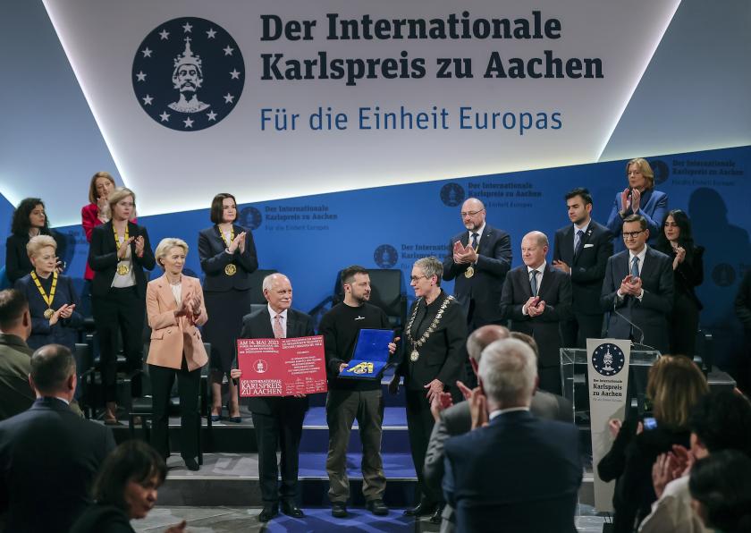 Ukrainian President Volodymyr Zelensky (C) receives the Charlemagne Prize (Karlspreis) during the award ceremony in the town hall of Aachen, Germany, 14 May 2023. This year's prize will be awarded to Ukraine's President Volodymyr Zelensky and the Ukrainian people. The International Charlemagne Prize of Aachen has been awarded annually since 1950 to people who have contributed to the ideals upon which Europe has been founded. EPA/FRIEDEMANN VOGEL Ukrainian President Volodymyr Zelensky (C) receives the Charlemagne Prize (Karlspreis) during the award ceremony in the town hall of Aachen, Germany, 14 May 2023. This year's prize will be awarded to Ukraine's President Volodymyr Zelensky and the Ukrainian people. The International Charlemagne Prize of Aachen has been awarded annually since 1950 to people who have contributed to the ideals upon which Europe has been founded. EPA/FRIEDEMANN VOGEL