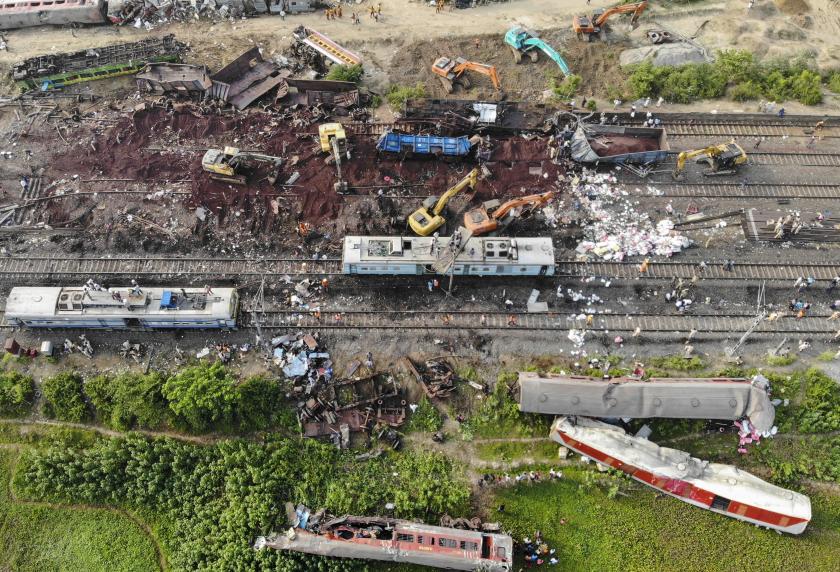 This aerial view shows excavators and rescue workers operating at the accident site of a three-train collision near Balasore, about 200 km (125 miles) from the state capital Bhubaneswar in the eastern state of Odisha, on June 4, 2023. Authorities were scrambling on June 4 to understand the cause of a three-train collision in India that killed at least 288 people, claiming that "no one responsible" will be spared. Punit PARANJPE / AFP This aerial view shows excavators and rescue workers operating at the accident site of a three-train collision near Balasore, about 200 km (125 miles) from the state capital Bhubaneswar in the eastern state of Odisha, on June 4, 2023. Authorities were scrambling on June 4 to understand the cause of a three-train collision in India that killed at least 288 people, claiming that "no one responsible" will be spared. Punit PARANJPE / AFP