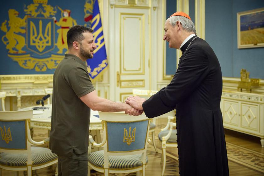 This handout photograph taken and released by the Ukrainian Presidential press service on June 6, 2023, shows Ukrainian President Volodymyr Zelensky (L) shaking hands with Pope Francis' peace envoy to Ukraine, Cardinal Matteo Zuppi, during their meeting in Kyiv, amid the Russian invasion of Ukraine. Handout / UKRAINIAN PRESIDENTIAL PRESS SERVICE / AFP