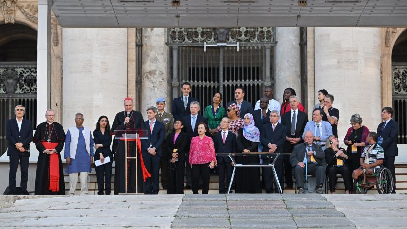 Cardinal Pietro Parolin (5th L) surrounded by Nobel Peace Prize winners, reads a message from Pope Francis after signing the "Declaration on Human Fraternity" during the "NotAlone World Fraternity" meeting in St.Peter's square at the Vatican, on June 10, 2023. Alberto PIZZOLI / AFP Cardinal Pietro Parolin (5th L) surrounded by Nobel Peace Prize winners, reads a message from Pope Francis after signing the "Declaration on Human Fraternity" during the "NotAlone World Fraternity" meeting in St.Peter's square at the Vatican, on June 10, 2023. Alberto PIZZOLI / AFP