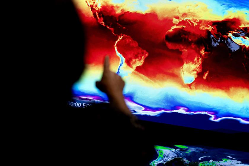 A NASA employee gestures towards a global map showing information coming in from NASA satellites at an immersive exhibit at NASA headquarters in Washington, DC, on June 21, 2023. NASA’s Earth Information Center, which is part physical, part online, is an effort that blends science and visualizations to allow visitors to see how our planet is changing. Stefani REYNOLDS / AFP A NASA employee gestures towards a global map showing information coming in from NASA satellites at an immersive exhibit at NASA headquarters in Washington, DC, on June 21, 2023. NASA’s Earth Information Center, which is part physical, part online, is an effort that blends science and visualizations to allow visitors to see how our planet is changing. Stefani REYNOLDS / AFP