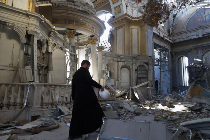 A priest examines the damages after the destruction of the Transfiguration Cathedral building as a result of a missile strike in Odesa, on July, 2023, amid the Russian invasion of Ukraine. Ukraine on Sunday said the death toll from overnight strikes by Russia on the port of Odesa rose to two, with 22 people wounded, including four children. Oleksandr GIMANOV / AFP A priest examines the damages after the destruction of the Transfiguration Cathedral building as a result of a missile strike in Odesa, on July, 2023, amid the Russian invasion of Ukraine. Ukraine on Sunday said the death toll from overnight strikes by Russia on the port of Odesa rose to two, with 22 people wounded, including four children. Oleksandr GIMANOV / AFP