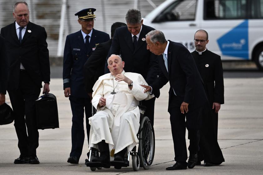 Pope Francis (C) speaks with Portuguese President Marcelo Rebelo de Sousa (2nd-R) after landing at the Figo Maduro air base in Lisbon to attend the World Youth Day (WYD) gathering of young Catholics, on August 2, 2023. Pope Francis arrived in Lisbon today to gather with a million youngsters from across the world at the World Youth Day (WYD), held as the Church reflects on its future. The 86-year-old underwent major abdominal surgery just two months ago, but that has not stopped an event-packed 42nd trip abroad, with 11 speeches and around 20 meetings scheduled. Marco BERTORELLO / AFP Pope Francis (C) speaks with Portuguese President Marcelo Rebelo de Sousa (2nd-R) after landing at the Figo Maduro air base in Lisbon to attend the World Youth Day (WYD) gathering of young Catholics, on August 2, 2023. Pope Francis arrived in Lisbon today to gather with a million youngsters from across the world at the World Youth Day (WYD), held as the Church reflects on its future. The 86-year-old underwent major abdominal surgery just two months ago, but that has not stopped an event-packed 42nd trip abr