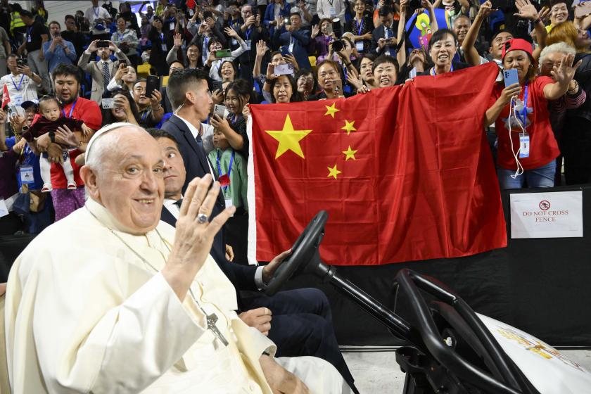 This handout photo taken and released by Vatican Media on September 3, 2023 shows Pope Francis being driven past a Chinese flag during his arrival for Holy Mass at the Steppe Arena in Ulaanbaatar. This handout photo taken and released by Vatican Media on September 3, 2023 shows Pope Francis being driven past a Chinese flag during his arrival for Holy Mass at the Steppe Arena in Ulaanbaatar.