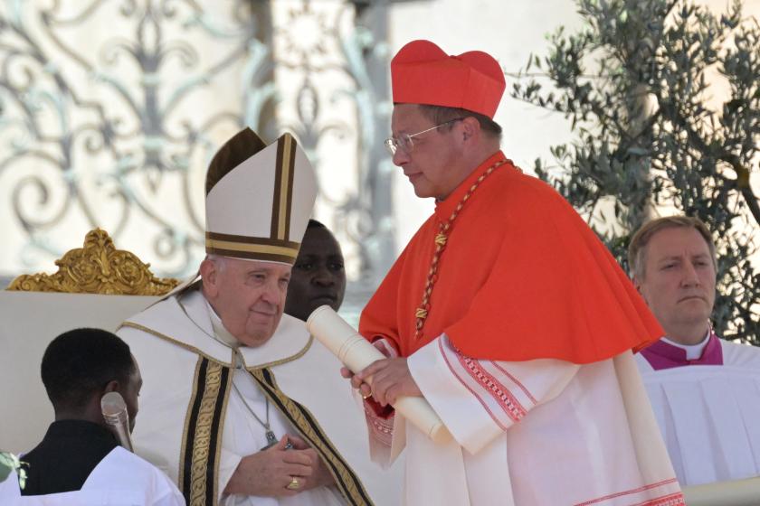 Polish archbishop from Lodz, Grzegorz Rys (R) is elevated cardinal by Pope Francis during a consistory to create 21 new cardinals at St. Peter's square in The Vatican on September 30, 2023. Pope Francis elevates 21 clergymen from all corners of the world to the rank of cardinal -- most of whom may one day cast ballots to elect his successor. Tiziana FABI / AFP Polish archbishop from Lodz, Grzegorz Rys (R) is elevated cardinal by Pope Francis during a consistory to create 21 new cardinals at St. Peter's square in The Vatican on September 30, 2023. Pope Francis elevates 21 clergymen from all corners of the world to the rank of cardinal -- most of whom may one day cast ballots to elect his successor. Tiziana FABI / AFP
