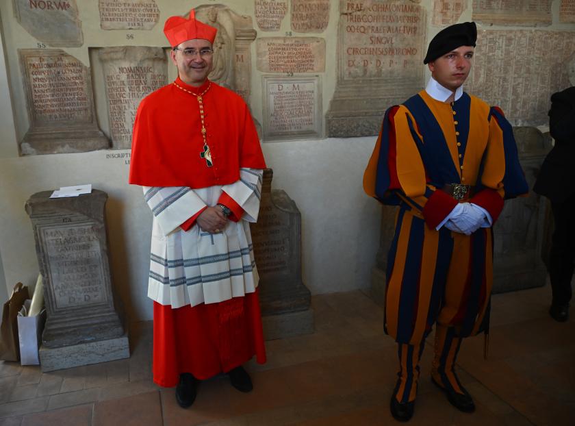 Newly elevated cardinal, Portuguese bishop of Setubal Americo Manuel Alves Aguiar, attends a courtesy visit of relatives following a consistory for the creation of 21 new cardinals in The Vatican on September 30, 2023. Pope Francis elevates 21 clergymen from all corners of the world to the rank of cardinal -- most of whom may one day cast ballots to elect his successor. Filippo MONTEFORTE / AFP Newly elevated cardinal, Portuguese bishop of Setubal Americo Manuel Alves Aguiar, attends a courtesy visit of relatives following a consistory for the creation of 21 new cardinals in The Vatican on September 30, 2023. Pope Francis elevates 21 clergymen from all corners of the world to the rank of cardinal -- most of whom may one day cast ballots to elect his successor. Filippo MONTEFORTE / AFP