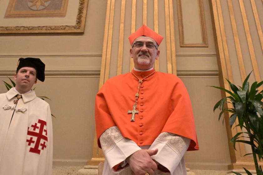 Newly elevated cardinal, Italian Latin Patriarch of Jerusalem Pierbattista Pizzaballa, attends a courtesy visit of relatives following a consistory for the creation of 21 new cardinals in The Vatican on September 30, 2023. Pope Francis elevates 21 clergymen from all corners of the world to the rank of cardinal -- most of whom may one day cast ballots to elect his successor. Tiziana FABI / AFP Newly elevated cardinal, Italian Latin Patriarch of Jerusalem Pierbattista Pizzaballa, attends a courtesy visit of relatives following a consistory for the creation of 21 new cardinals in The Vatican on September 30, 2023. Pope Francis elevates 21 clergymen from all corners of the world to the rank of cardinal -- most of whom may one day cast ballots to elect his successor. Tiziana FABI / AFP