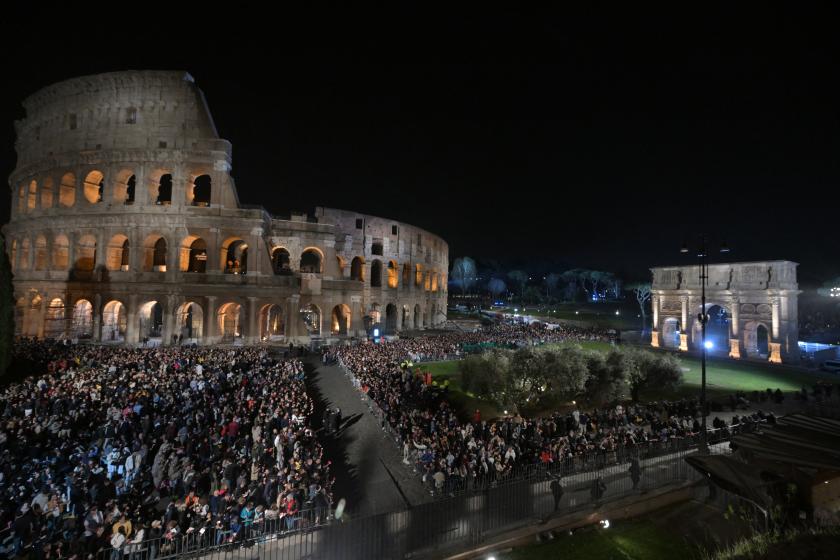 People gather for the Way of the Cross (Via Crucis) presided by Pope Francis at the Colosseum as part of the Holy Week celebrations, on March 29, 2024 in Rome. Pope Francis pulled out of Friday's Way of the Cross ceremony at the last minute, with the Vatican saying he wanted to "preserve his health" ahead of other Easter events this weekend. "To preserve his health ahead of tomorrow's vigil and the Easter Sunday mass, Pope Francis will this evening follow the Way of the Cross at the Coliseum from the Saint 