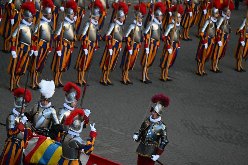A Swiss Guard recruit holds the Swiss Guard flag as he swears-in during a ceremony for new recruits of the pontifical Swiss Guard at the Vatican, on May 6, 2024. Filippo MONTEFORTE / AFP A Swiss Guard recruit holds the Swiss Guard flag as he swears-in during a ceremony for new recruits of the pontifical Swiss Guard at the Vatican, on May 6, 2024. Filippo MONTEFORTE / AFP