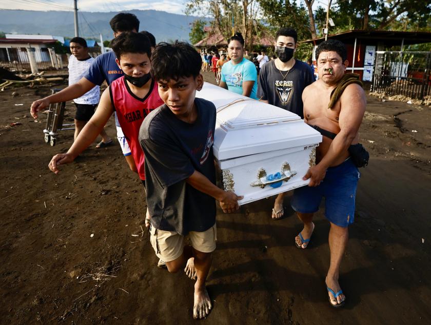 Villagers carry a coffin during a burial rite in the aftermath of Tropical Storm Trami in the town of Laurel, Batangas province, Philippines, 27 October 2024. Villagers carry a coffin during a burial rite in the aftermath of Tropical Storm Trami in the town of Laurel, Batangas province, Philippines, 27 October 2024.